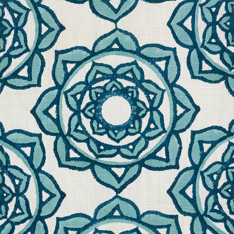 Teal mandala-inspired geometric pattern on cream fabric; repeating circular rosettes with layered star shapes.