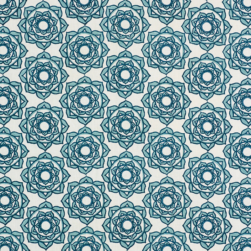 Repeating blue mandala circles on a beige backdrop; hand-block-printed geometric textile pattern.