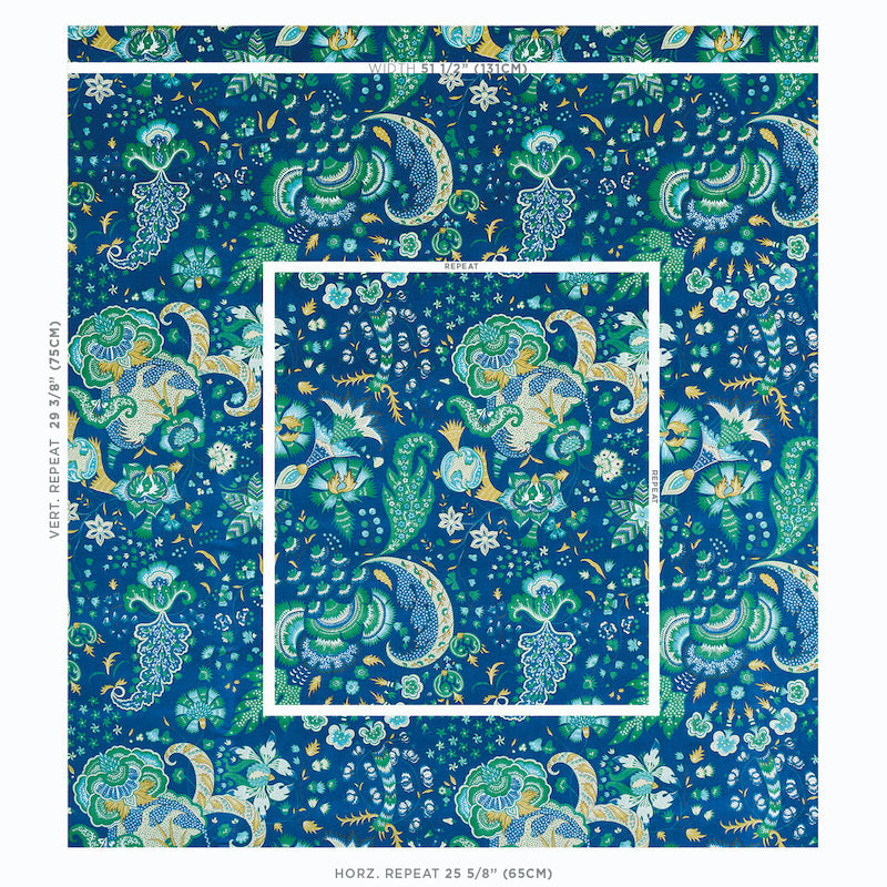 Blue velvet fabric with a vibrant paisley floral pattern in teal and turquoise, featuring crescent motifs.