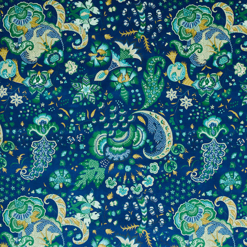 Blue paisley floral fabric with teal, green, aqua and gold motifs; ornate decorative print for garments or upholstery.