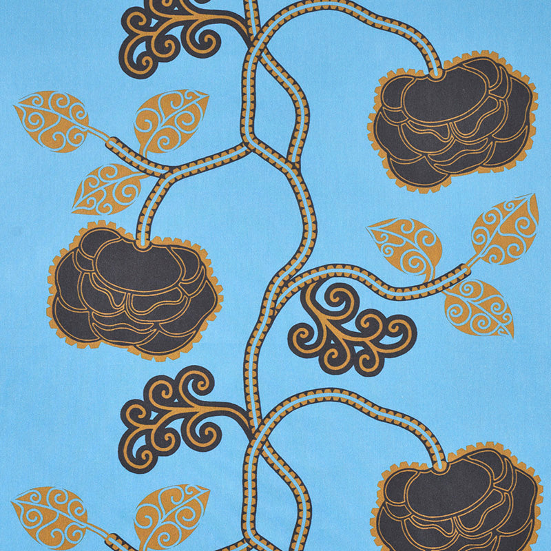 Blue fabric print with twisting brown vines, dark brown rosettes outlined in gold and gold-accented leaves.
