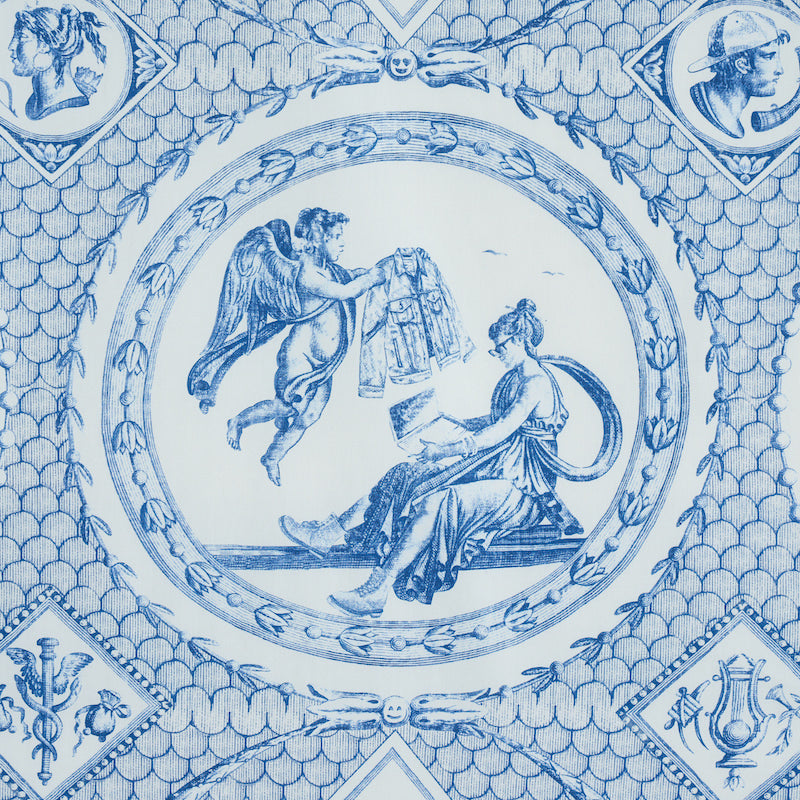 Round blue-and-white porcelain plate with neoclassical scene: winged figure and seated woman amid laurel border