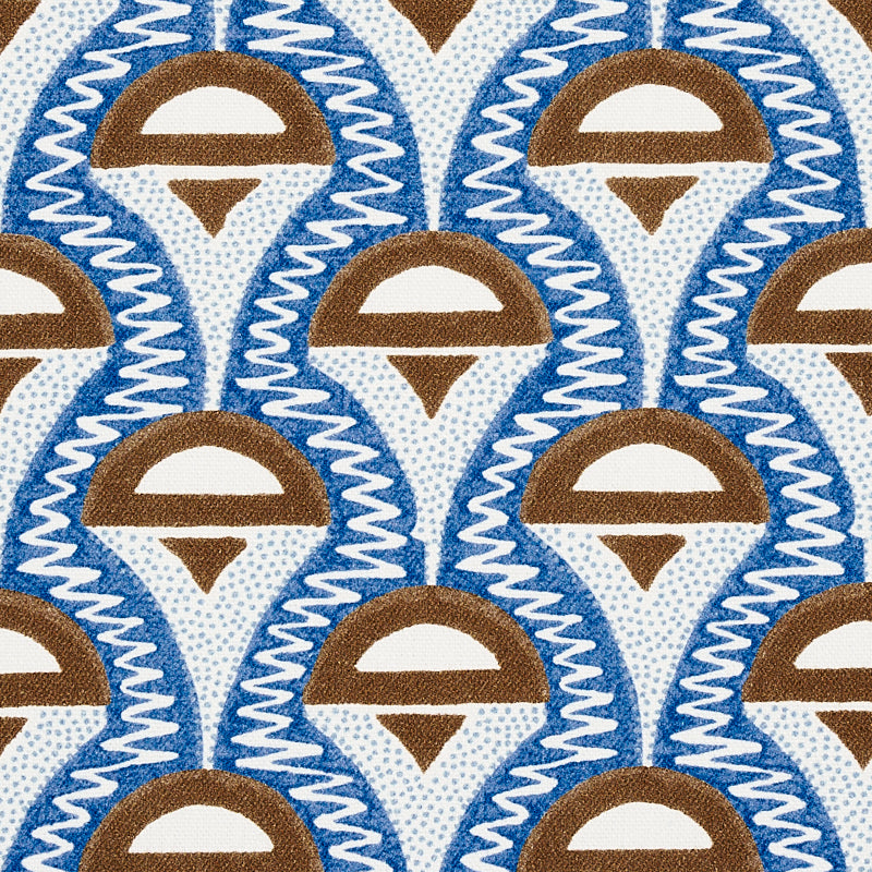 Repeating blue and brown teardrop motif with white arc, bordered by white zigzag lines on fabric.