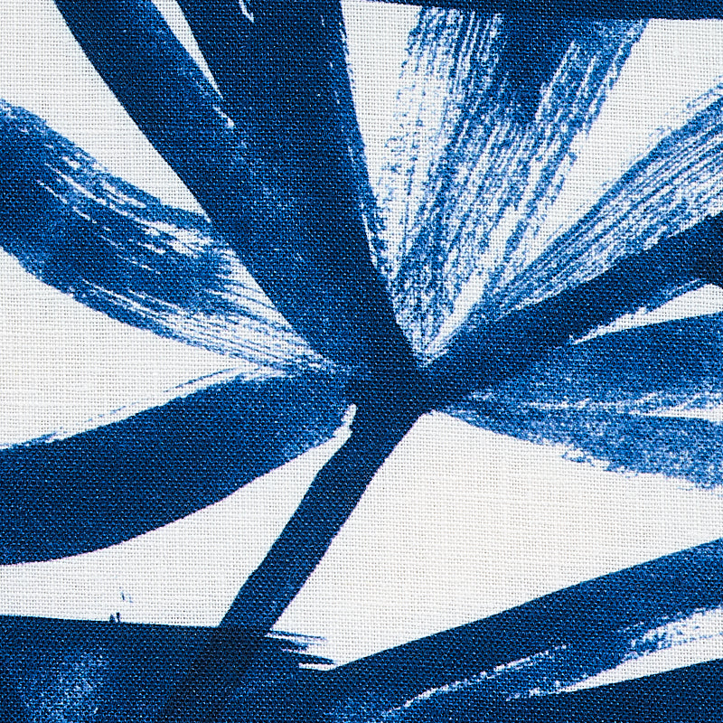 Abstract blue brush-stroke palm-leaf pattern on white textile.