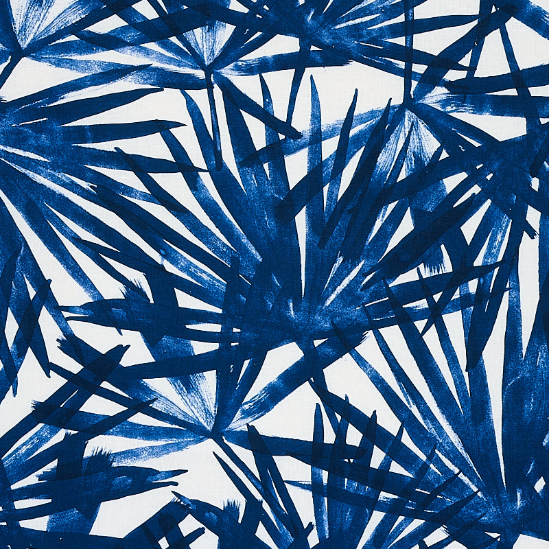 Indigo blue palm leaf print on white; bold tropical textile pattern, versatile for fabric or decor.