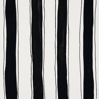 White fabric with irregular black vertical stripes; bold modern monochrome textile pattern for curtains or upholstery.