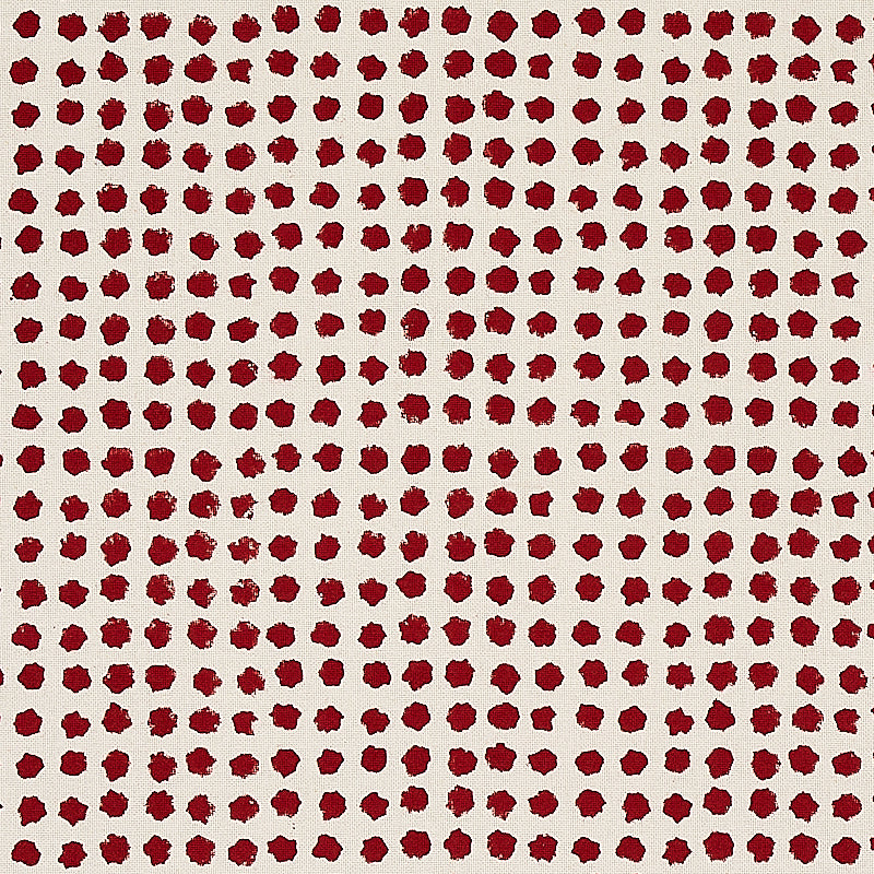 Grid of small maroon circular dots on a cream background; retro dotted fabric pattern.