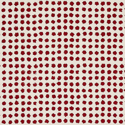Grid of small maroon circular dots on a cream background; retro dotted fabric pattern.