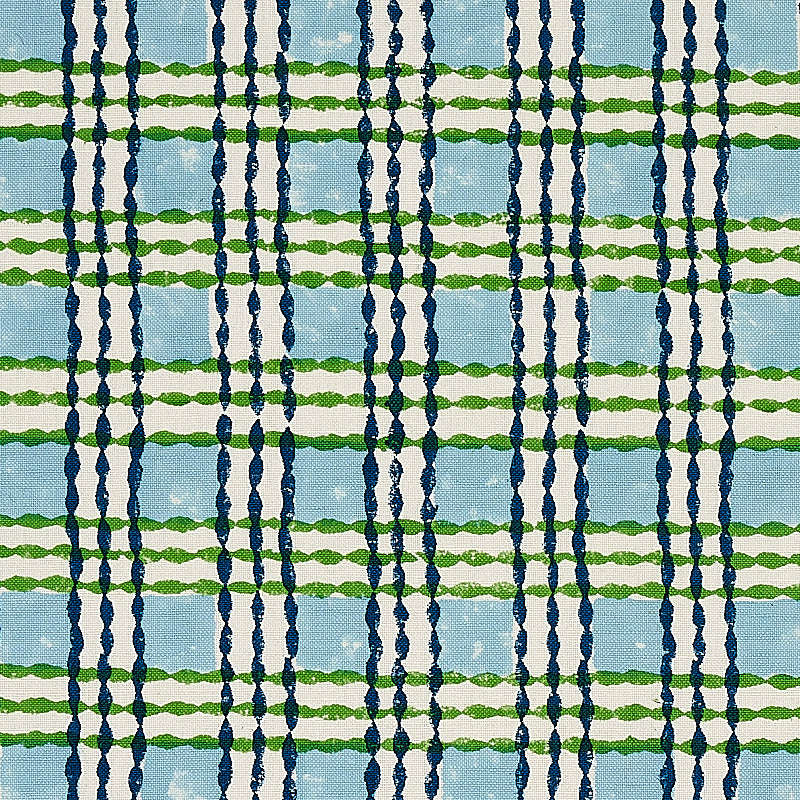 Hand-block-printed trellis pattern on fabric, sky blue background with grass green lattice design.