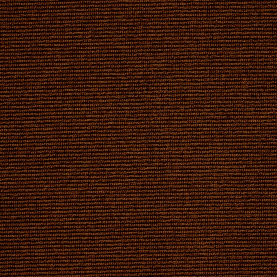 Dark brown ribbed upholstery fabric close-up; warm textured textile for furniture.