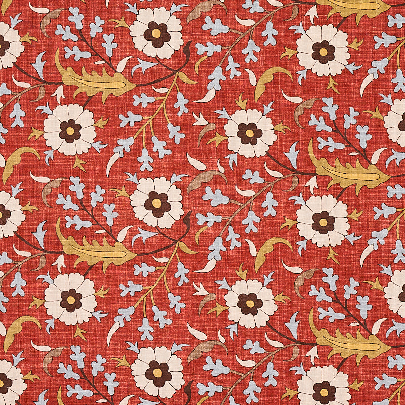 Red-orange floral textile print with white daisy-like flowers, dark centers, gold leaves, and light blue accents.
