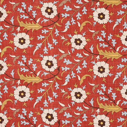 Red-orange floral textile print with white daisy-like flowers, dark centers, gold leaves, and light blue accents.