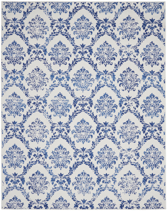 Blue damask pattern with ornate floral medallions on a white backdrop; farmhouse style rug, 8' x 10'.