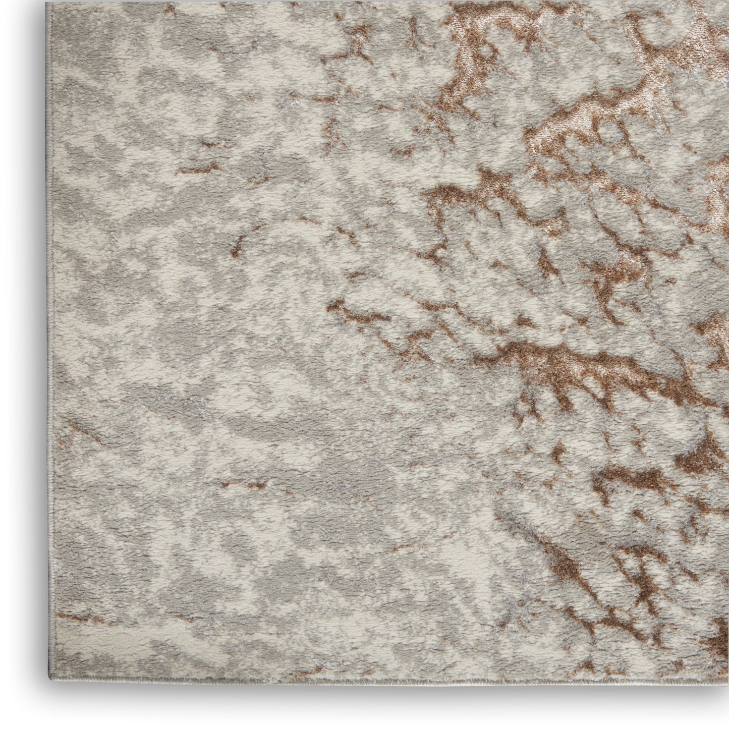 Soft plush rug in light gray with tan-brown marbled veining; 5' x 7' area rug.