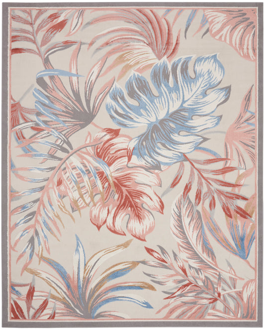 Rectangular beige rug with large tropical leaves in pink, blue and coral; soft gray border.