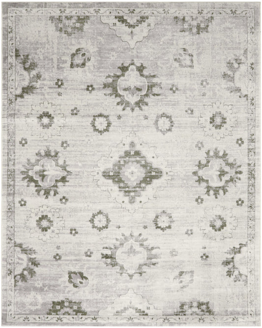 Distressed light gray-beige oriental area rug with faded medallion motifs and subtle border.