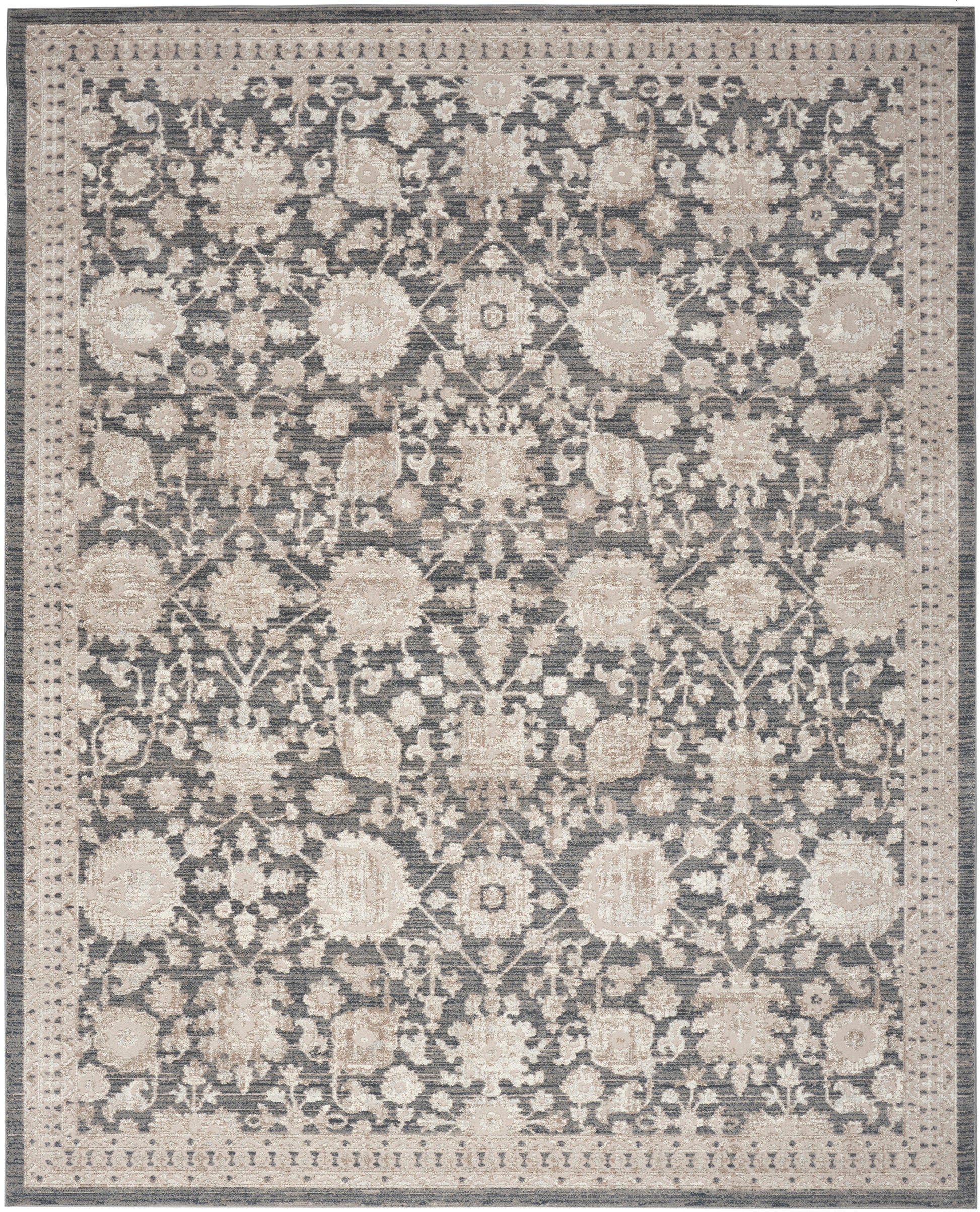Rectangular area rug with muted blue-gray field and cream floral pattern, ornate border, traditional oriental style.