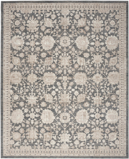 Rectangular area rug with muted blue-gray field and cream floral pattern, ornate border, traditional oriental style.