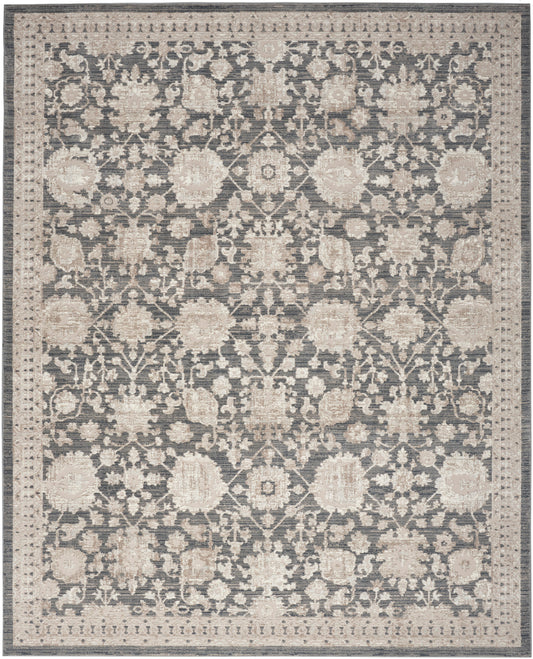 Rectangular area rug with muted blue-gray field and cream floral pattern, ornate border, traditional oriental style.