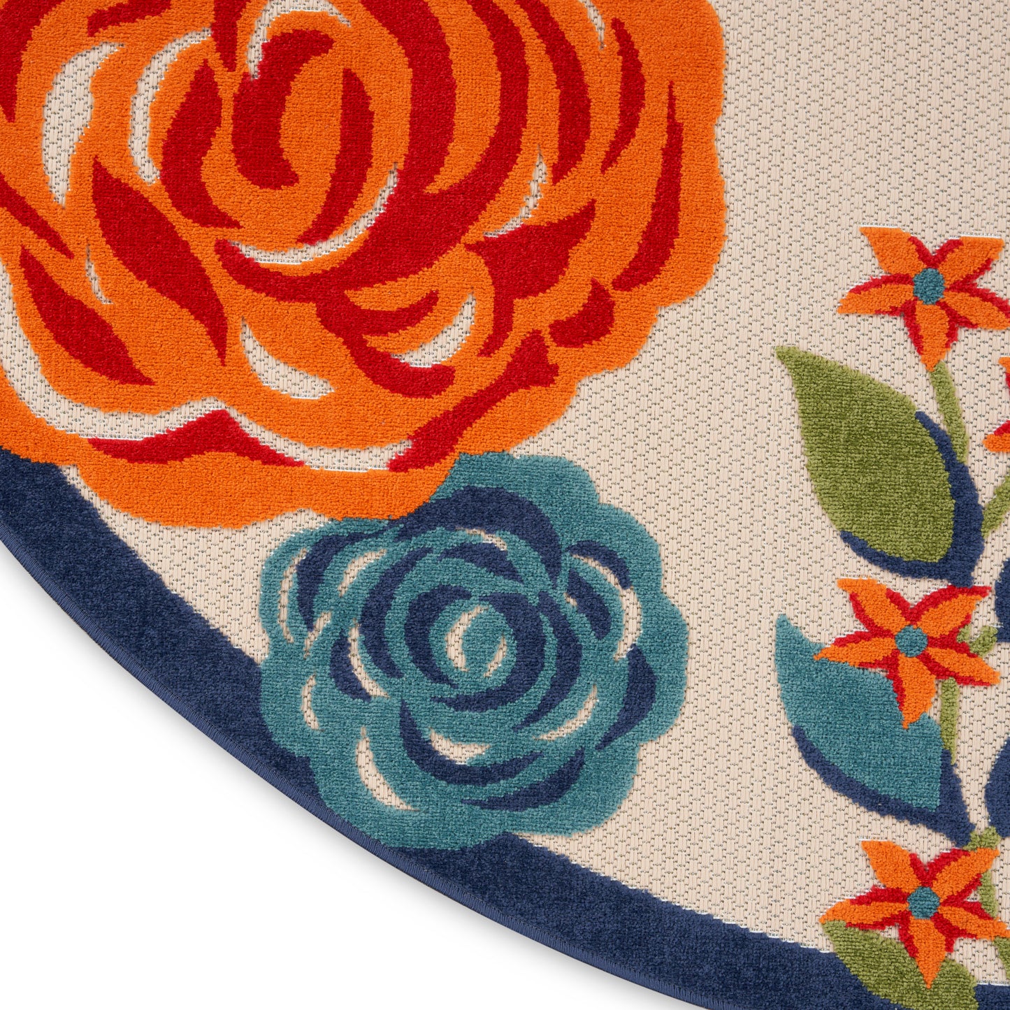 Round floral rug with bold orange and teal flowers, beige background, navy border and woven texture.