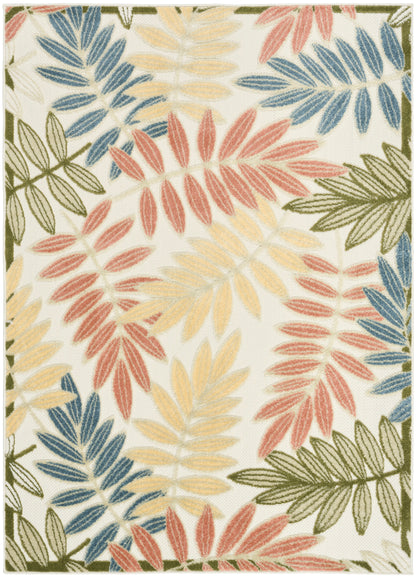 Rectangular rug with cream background and multicolored botanical leaves in blue, pink, yellow and olive green; bordered.