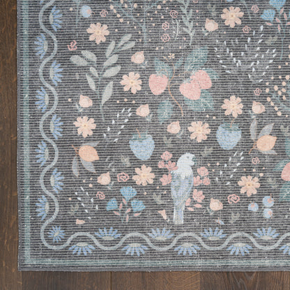 Gray-blue floral rug with pastel pink and blue blossoms, wavy border, featuring a blue parrot perched among flowers.