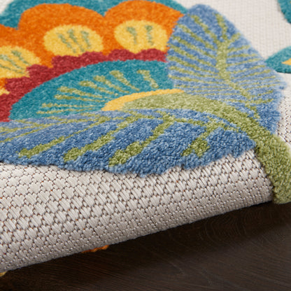 Bright butterfly-patterned rug with blue, orange and green wings on a beige woven base; soft tufted pile.
