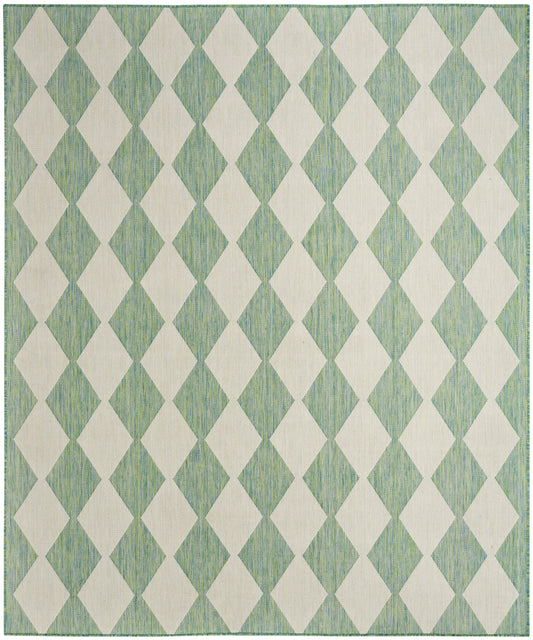 Teal-green rug with off-white diamond lattice pattern and woven texture.