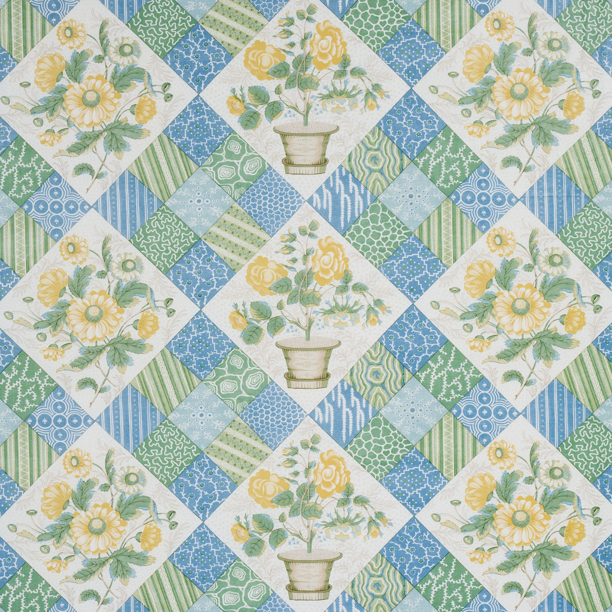 Vintage floral quilt fabric in patchwork diamonds; yellow flowers in vases with blue-green geometric squares.