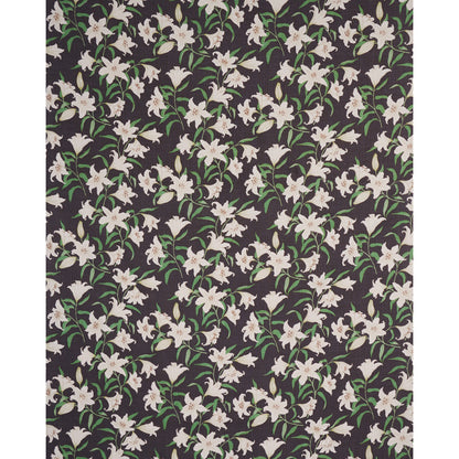 Dark fabric with repeating white lilies & green stems on black background; floral pattern for upholstery or apparel.