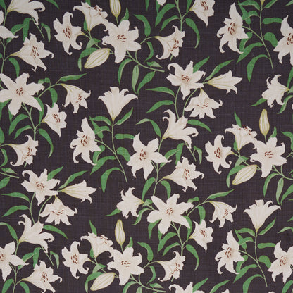 Charcoal fabric with dense white lily flowers and green stems, botanical floral print.