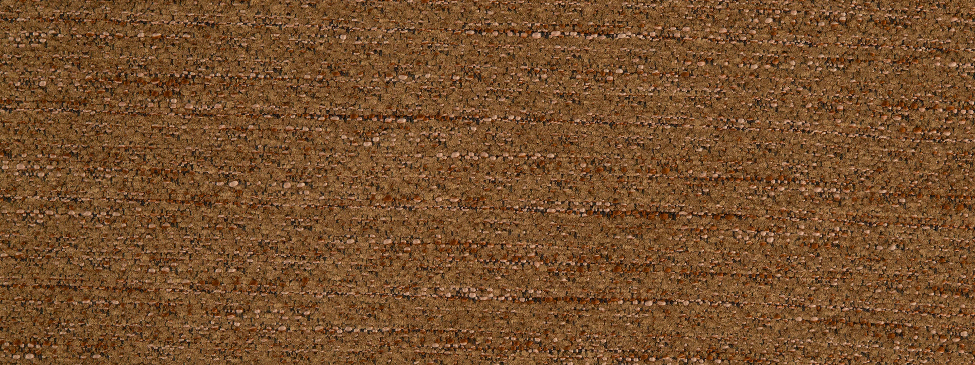 Close-up of saddle-colored upholstery fabric with a textured weave in warm brown tones.