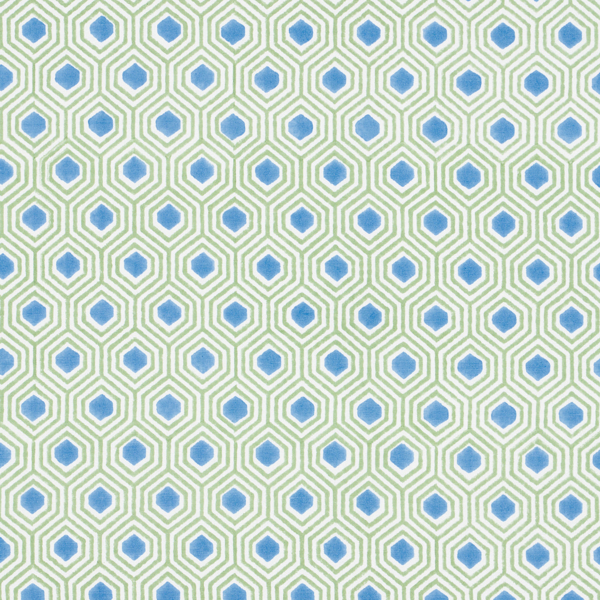 Geometric hex tile pattern with green outlines and blue centers on a pale background; repeating wallpaper/fabric design.