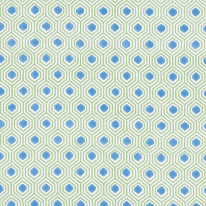 Geometric hex tile pattern with green outlines and blue centers on a pale background; repeating wallpaper/fabric design.
