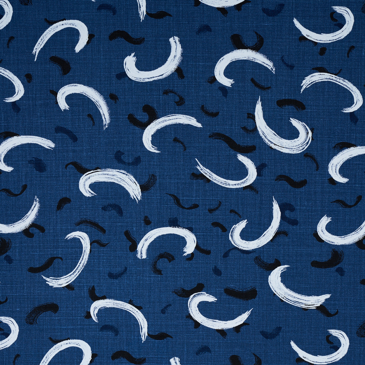 Navy blue fabric with white and black curved crescent brushstrokes; abstract modern textile for clothing or decor.