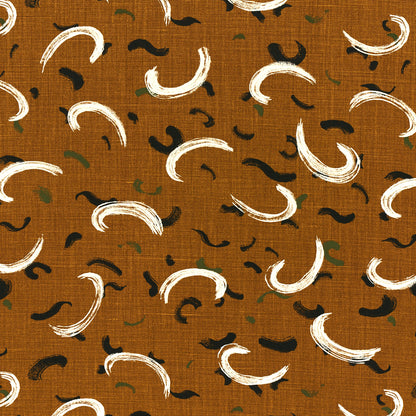 Gold fabric with white curved brushstroke motifs and small black and olive accents; abstract textile pattern.