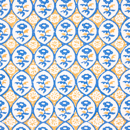 Blue oval medallions with floral motif on white, alternating yellow diamonds; bold tile-like wallpaper or fabric print.