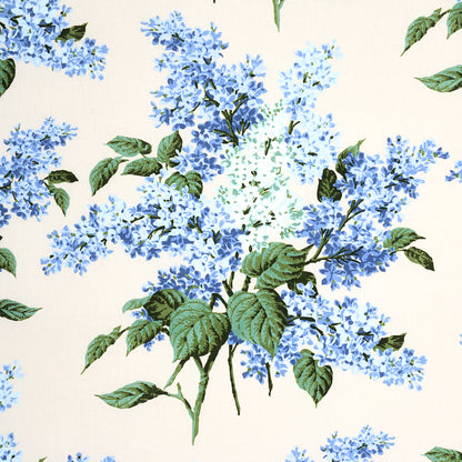 Cream fabric with blue hydrangea floral print and green leaves.