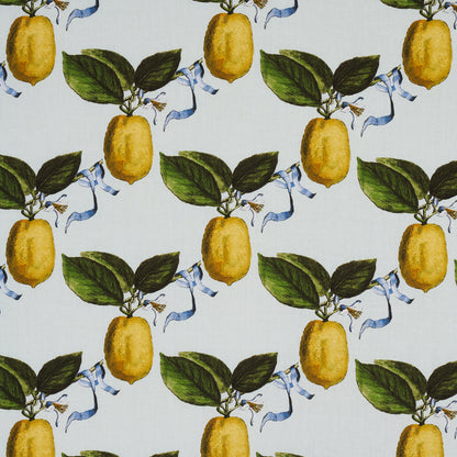 Lemon and leaf fabric pattern with yellow lemons, green leaves, and light blue ribbons on pale blue textile.