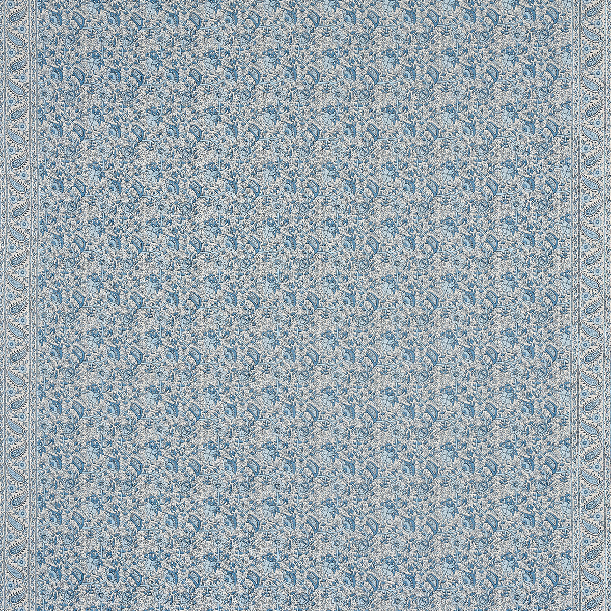 Blue damask-patterned textile with cream floral motifs and ornate border; rug-like fabric.