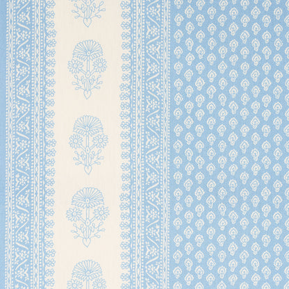 Blue and ivory printed fabric featuring a beige vertical stripe with blue floral medallions and a blue field with motifs.