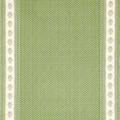 Green fabric with tiny white geometric print and white side borders with green floral motifs; decorative textile.