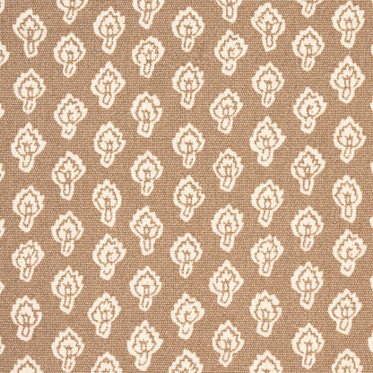 Tan fabric with a repeating white floral/teardrop motif forming a damask-like geometric pattern.
