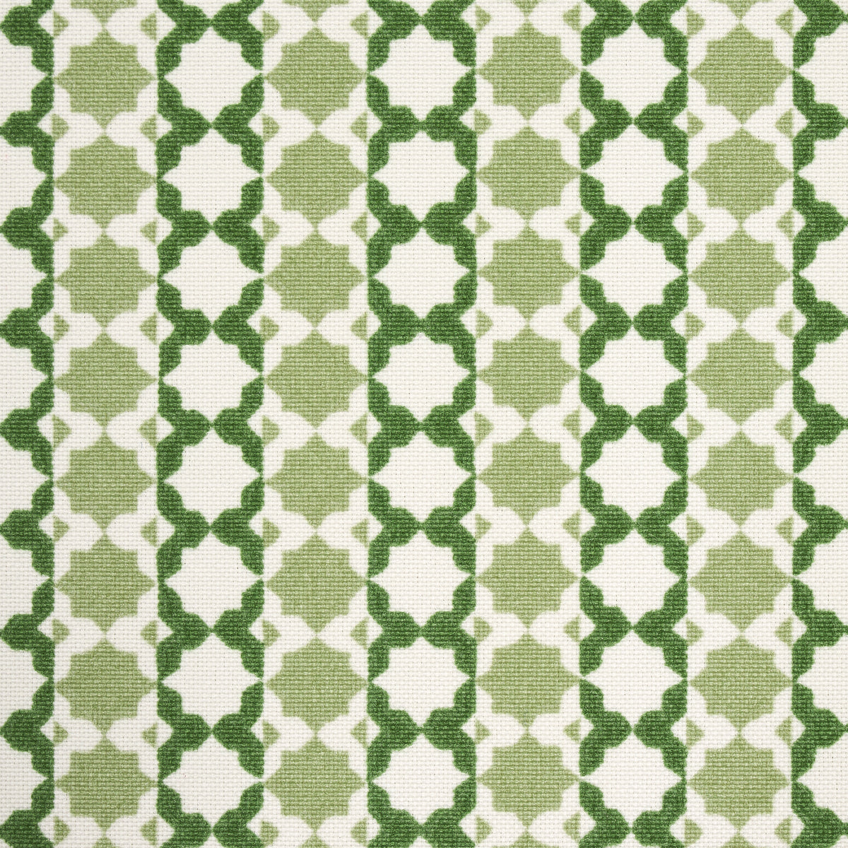 Green and white geometric lattice fabric with trellis motif, woven textile suitable for upholstery or decor.