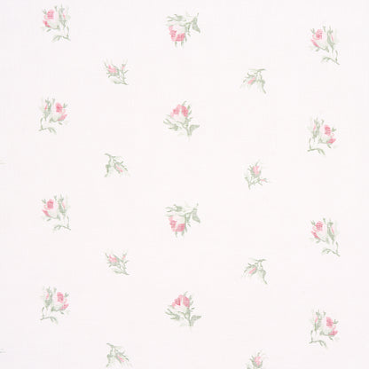 Cream background with scattered tiny pink rose bouquets and pale green leaves; delicate vintage floral print.
