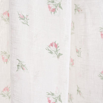 White sheer fabric with tiny pink rose prints and green leaves, light delicate curtain material.