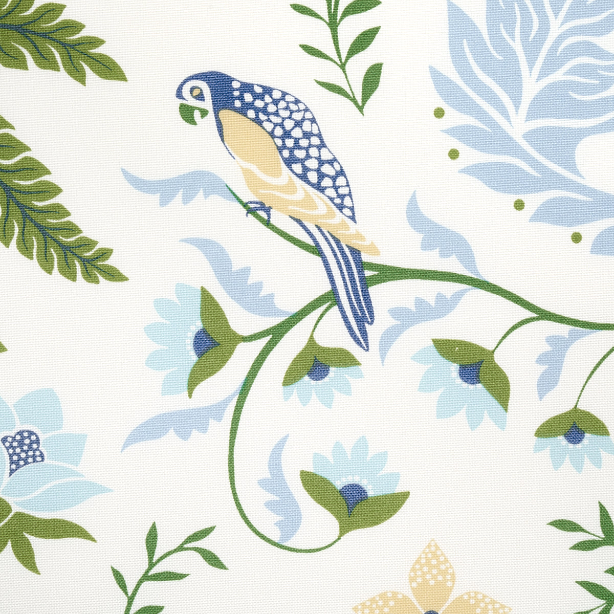 Blue and yellow parrot on green vine with blue floral motifs; tropical wallpaper print on cream background.