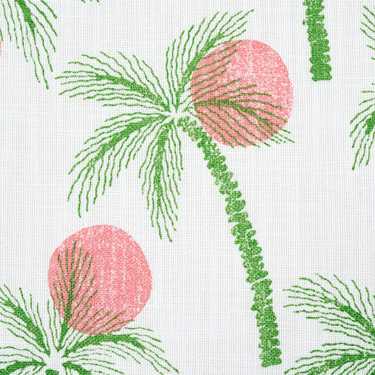 Tropical palm leaf print fabric with green fronds and pink circles against white backdrop; tropical home decor textile.