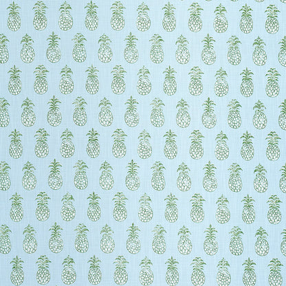 Repeating teal pineapple pattern on light blue fabric; tropical whimsical textile design.