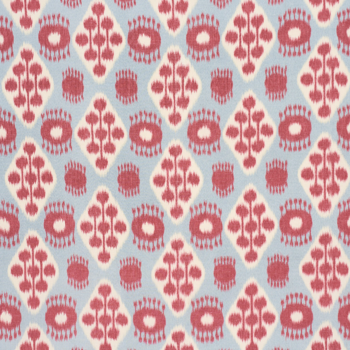 Light blue fabric with white diamond motifs featuring pink tree-branch shapes and pink circular floral accents.